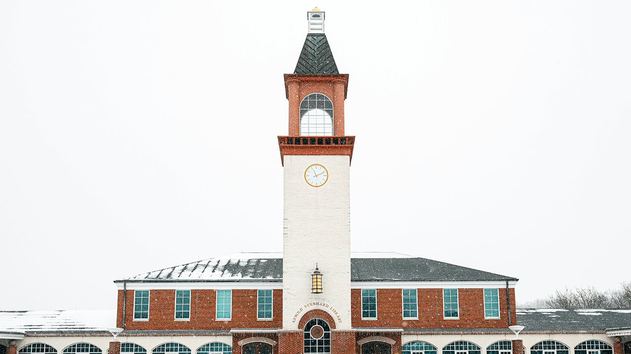 The Arnold Bernhard Library on Quinnipiac's Mount Carmel Campus is covered in snow.
