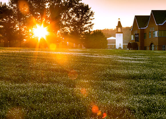 The sun rises over the Quad.