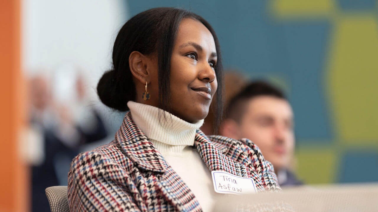 Girl sitting and listening at 2021 spring speaker event