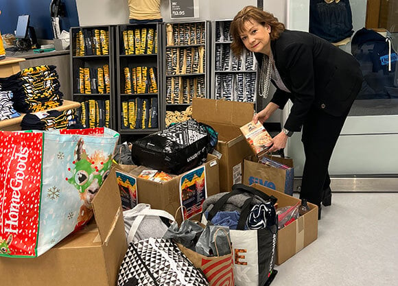 Cheryl Cartier, manager of the Quinnipiac bookstore, stands by the collection