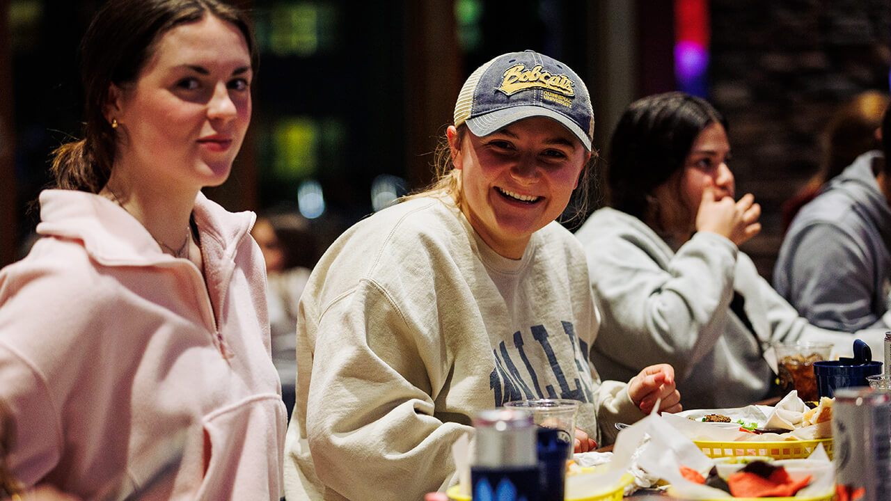 Class of 2023 student enjoying on the rocks pub and grill