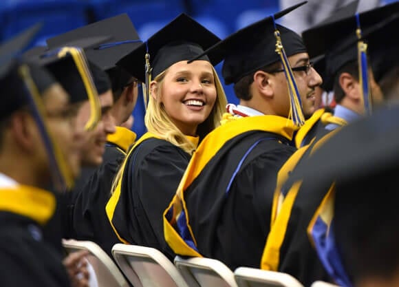 Casey Miller '17 looks back and smiles at graduation