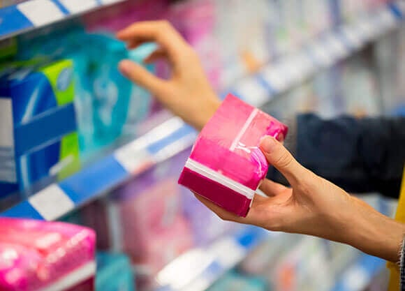 Woman reaching for feminine products