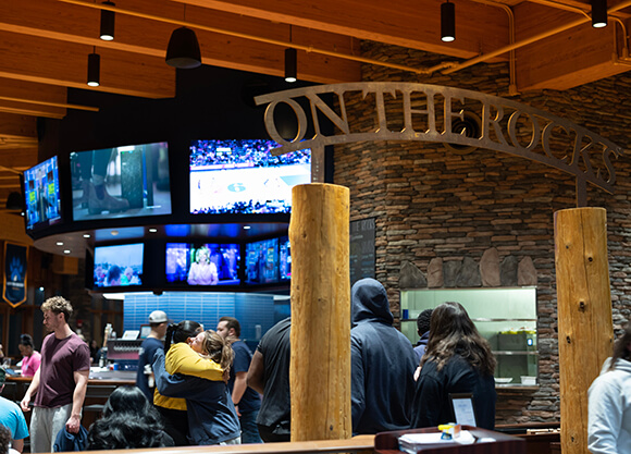 Students enjoying on campus pub and grill, on the rocks