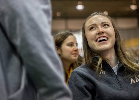 Kozyra smiles as she watches a speech during The Big Event.