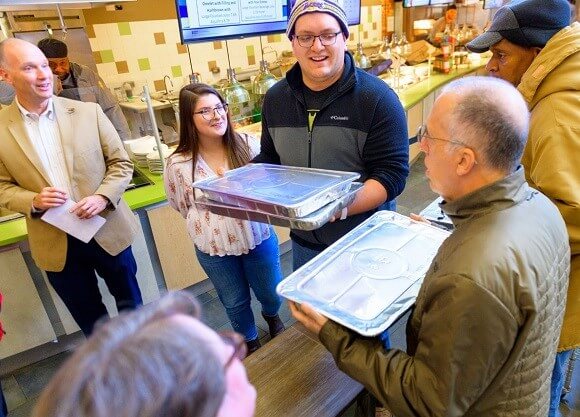 Members of our Chartwells and university community hand food to members of Haven's Harvest.