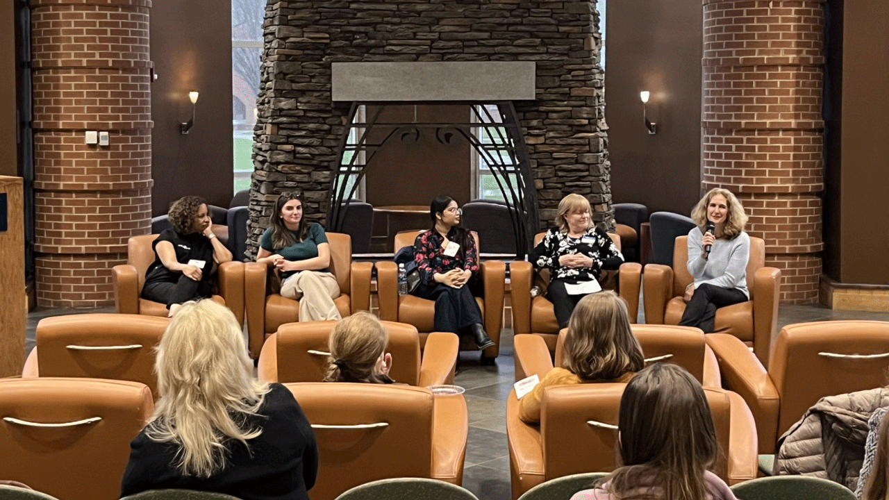 Panelists sit in the piazza in the Carl Hansen Student Center