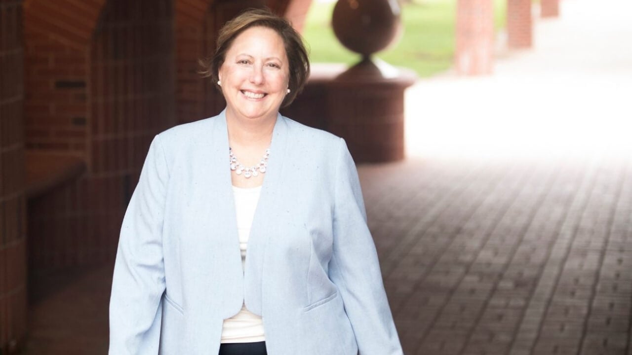 Angela Mattie smiling on campus