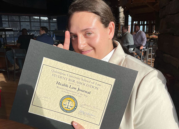 Alexa Binkowitz smiling with Student Organization award