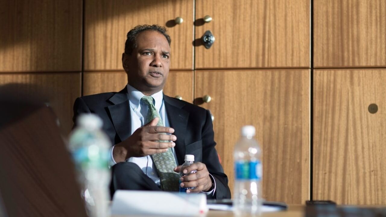 Assistant U.S. Attorney Dave Vatti sits in front of lockers in the School of Law Center.