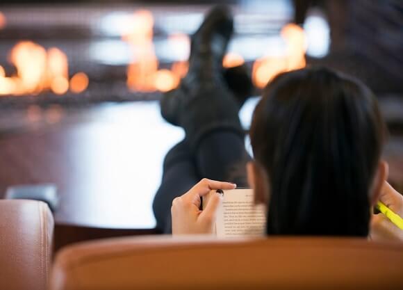 Reading by the fire in the The Carl Hansen Student Center Wednesday, Oct. 26, 2016.