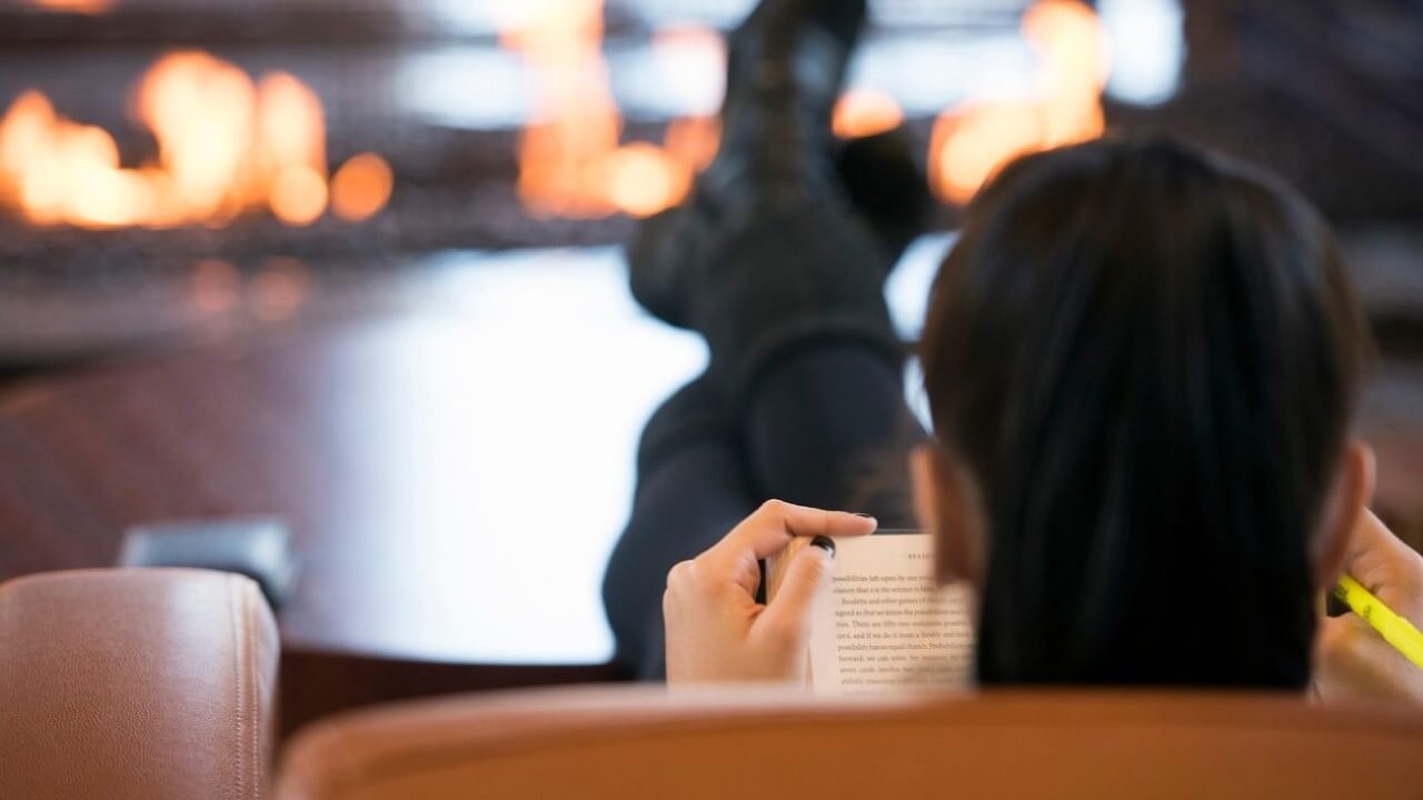 Reading by the fire in the The Carl Hansen Student Center Wednesday, Oct. 26, 2016.