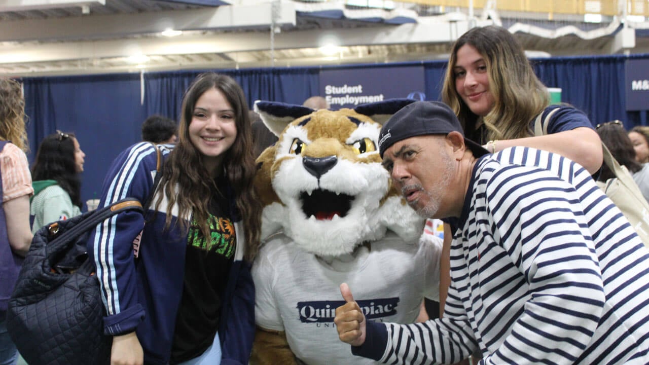 Family giving a thumbs up at Boomer the Bobcat