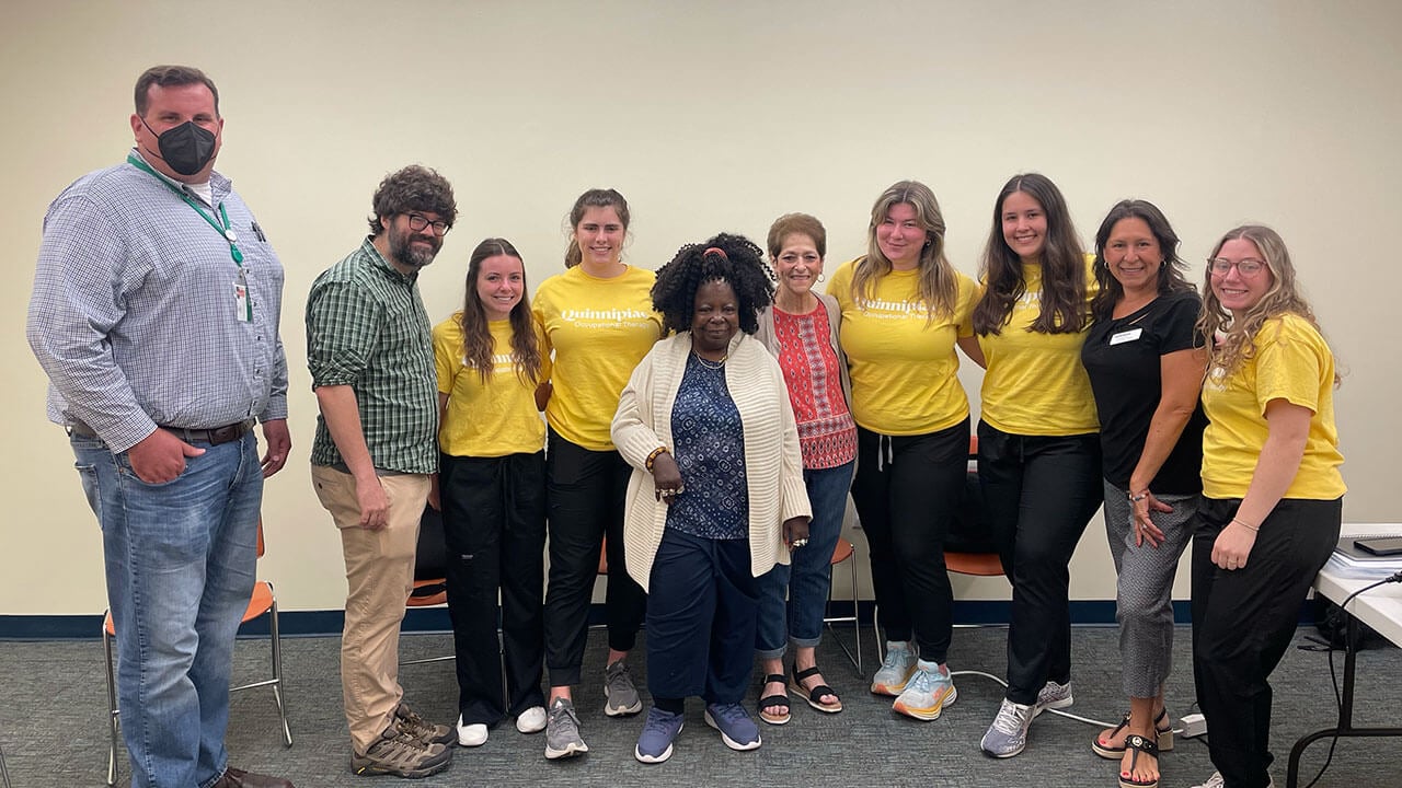 Quinnipiac occupational therapy students work with older individuals duals at the Hamden Public Library