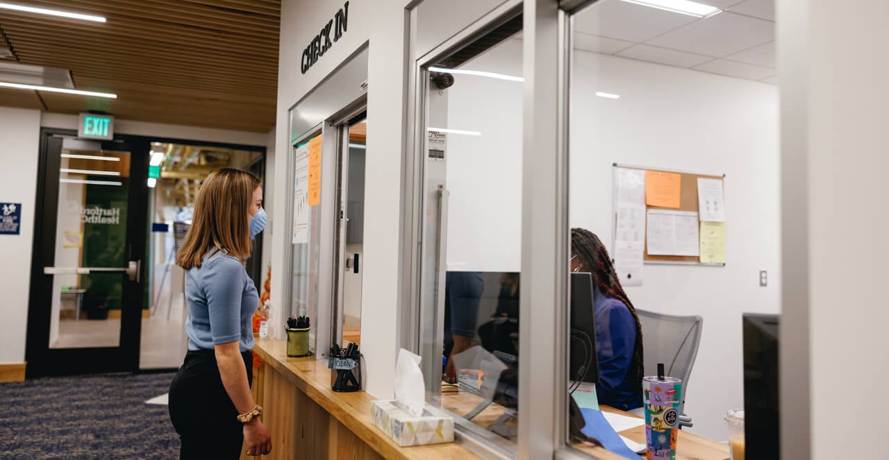 A student checks into student health services in the Recreation and Wellness Center