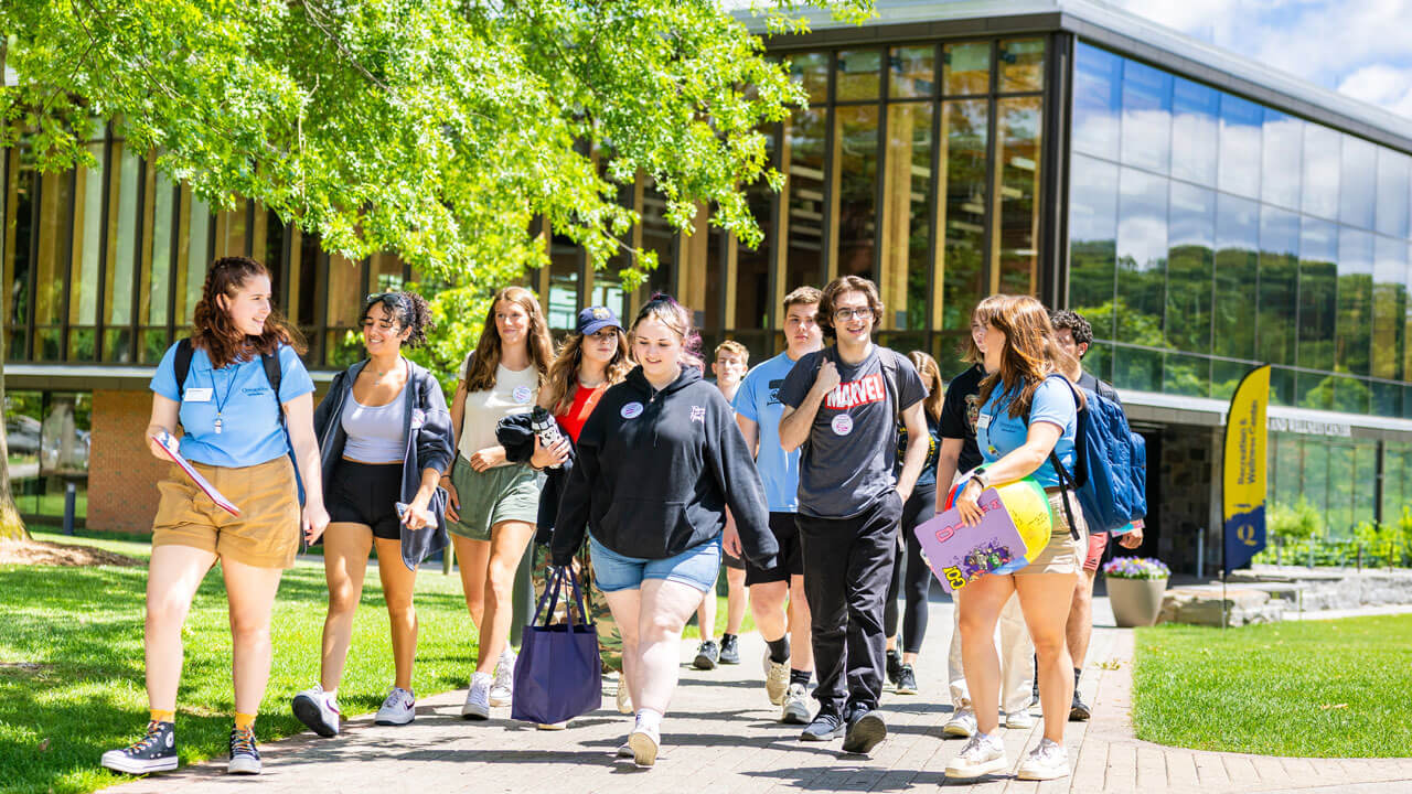 Group of students walking to the Quad with their orientation leader