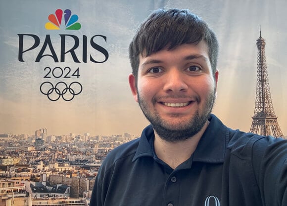 Clever Streich takes a selfie with the Paris 2024 logo