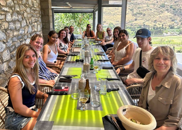 Quinnipiac COM 340 class together in Greece having lunch together