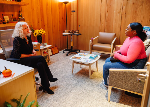 A student speaks with a licensed counselor in her Hartford Healthcare office