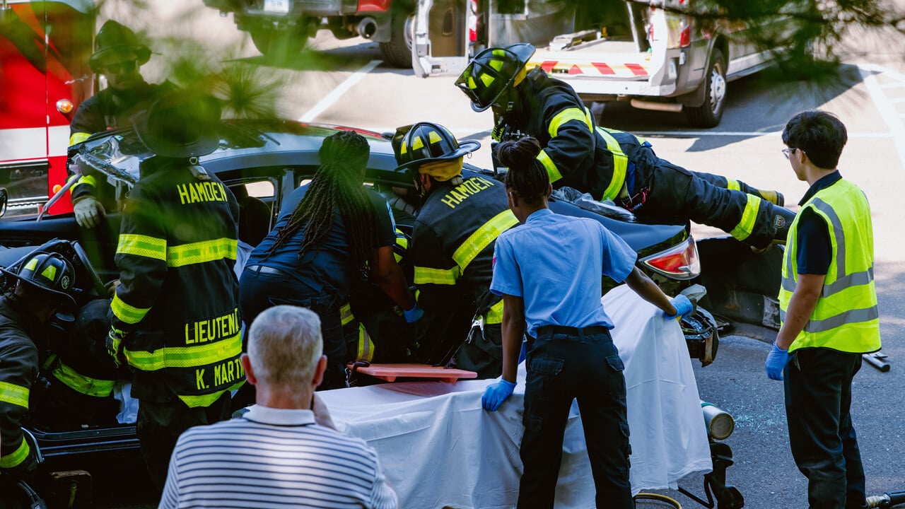 Hamden fire fighters work on a car rescue