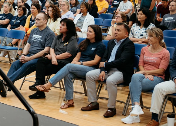 Five of the 2024 Center for Excellence awardees sit in the front row at convocation