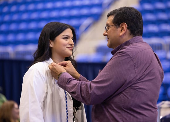 Student receives pin