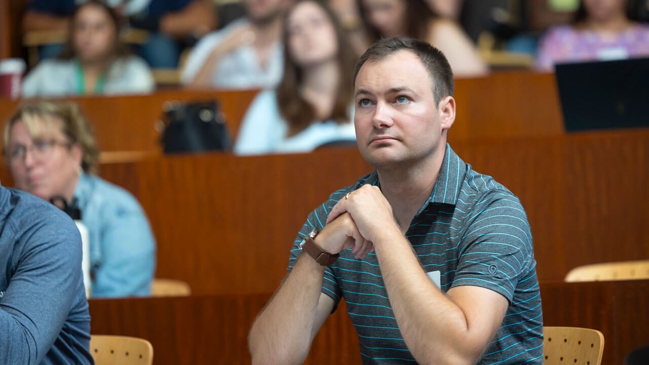 Graduate student locked in on guest speaker, taking in every word