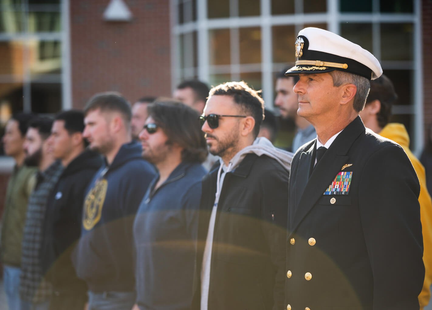 Veteran stands among crowd at a ceremony