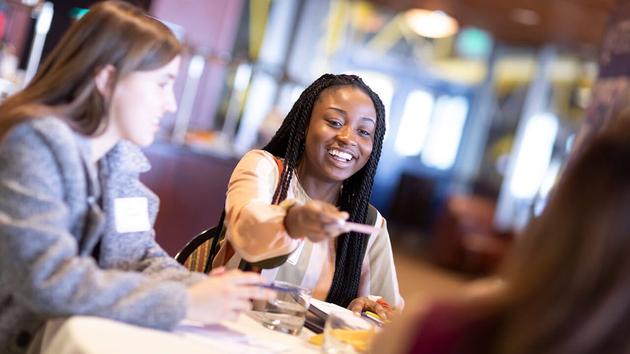 Students network at an event.