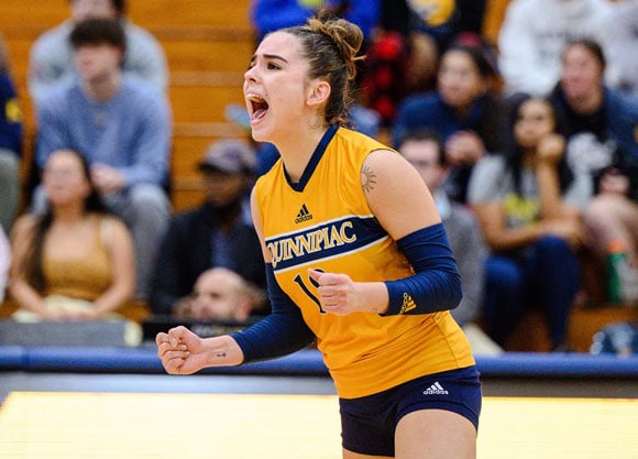 Quinnipiac volleyball player celebrates with excitement