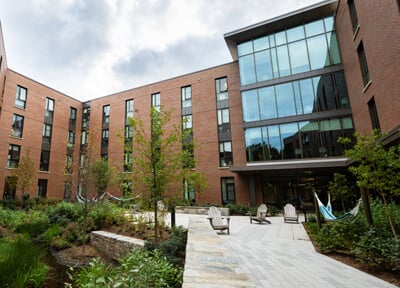 The outdoor courtyard of The Grove residence hall on a clear day