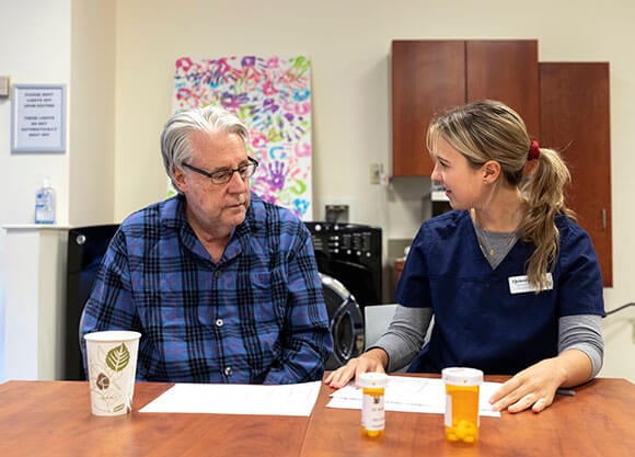 Analena Holihan, OT Graduate Student  ’21 practices different scenarios in the OT Lab with standardized patient John Hill