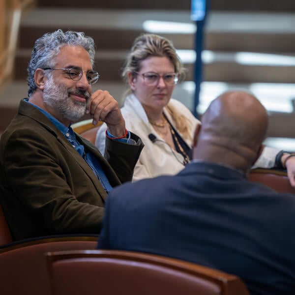 Mira Sucharov and Omar Dajani speak with moderator Claude Mayo in the Mount Carmel Auditorium