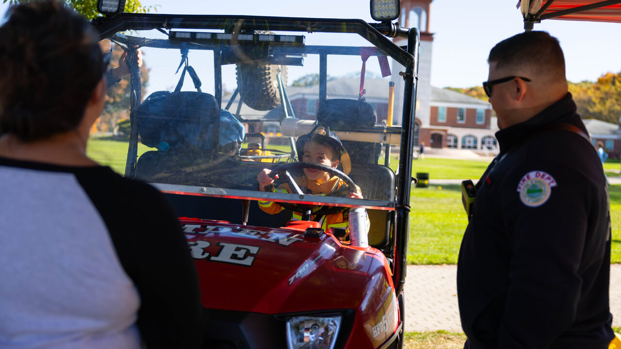 Person sits in a golf cart