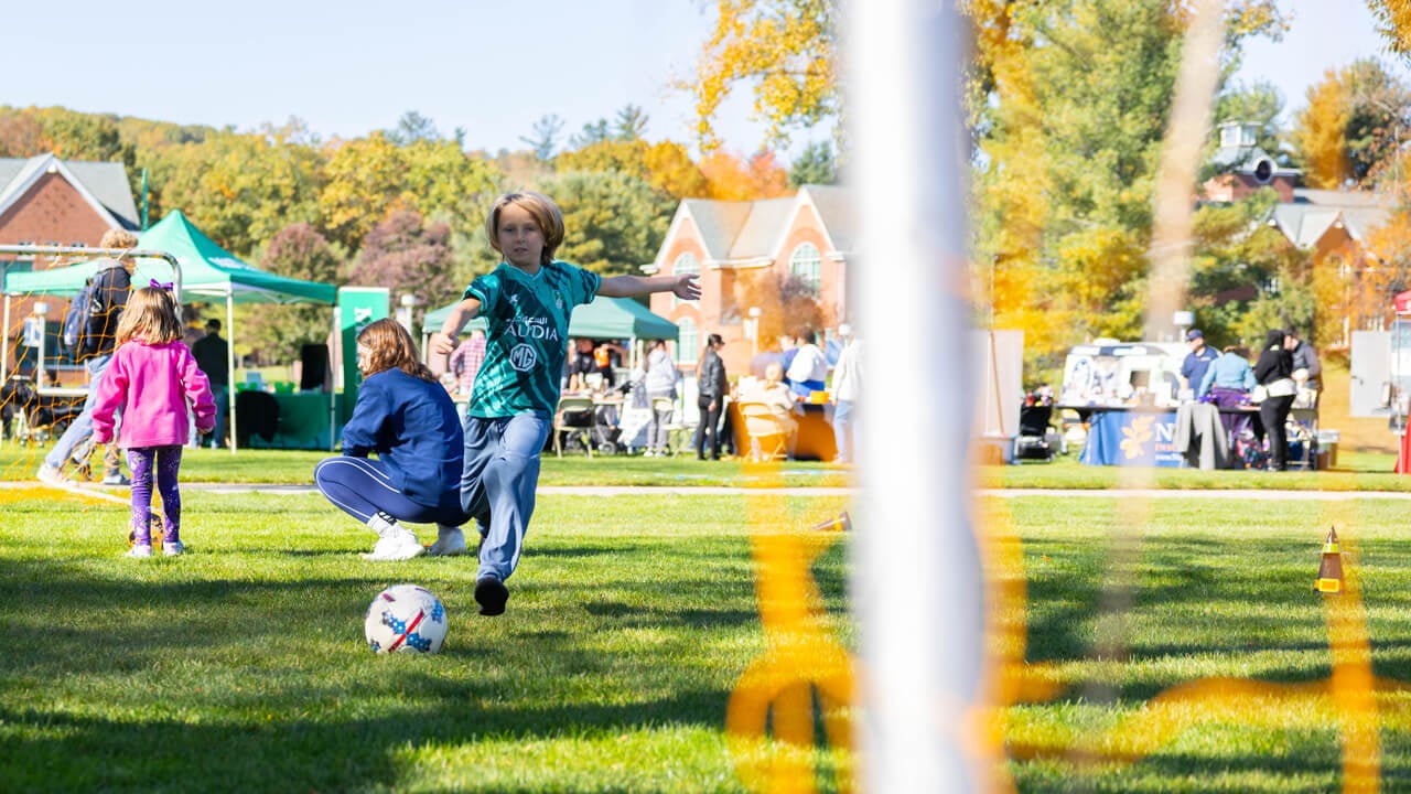 Person kicks a soccer ball