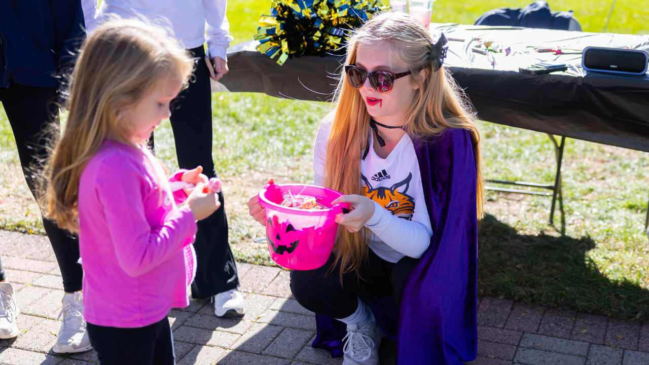 People hold a bucket of candy