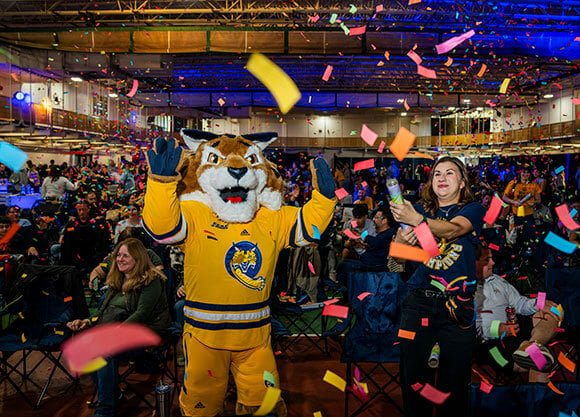 Boomer celebrates the launch of the For the Ambitious campaign with confetti.