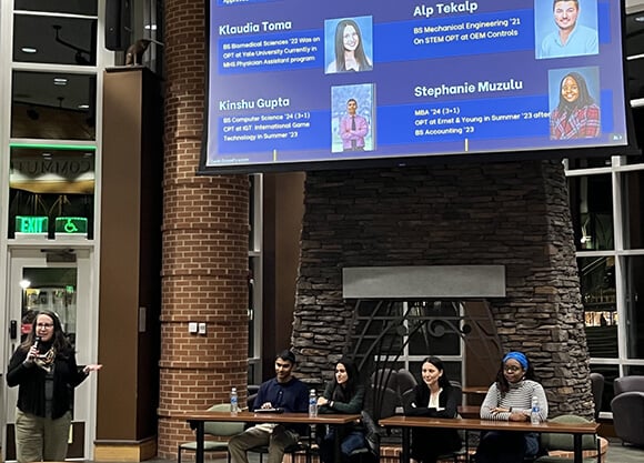 A Quinnipiac panel of international alumni and current students speak with interested students