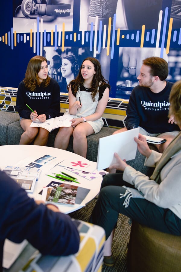 A group of students working together on a print project