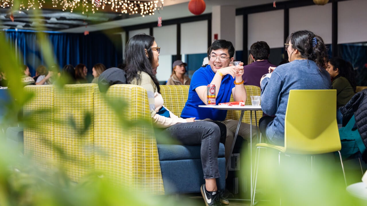 People sitting at a table as seen from afar