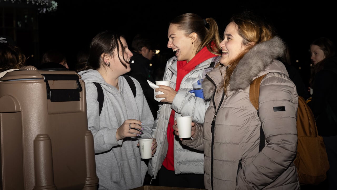 People stand in line with hot chocolate