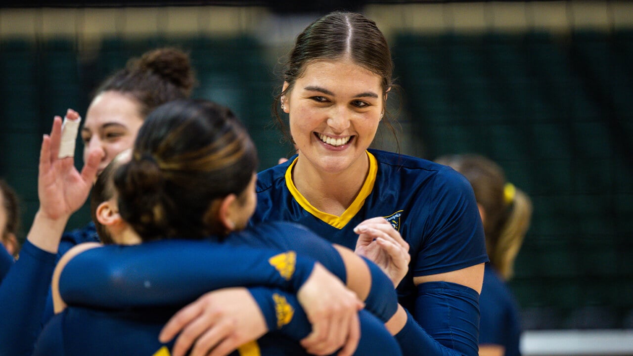 Nicole Legg smiling at teammates after winning the game.