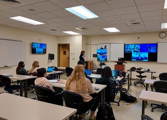 Professor Beth Larkins-Strathy’s education class meets with Miguel Cardona