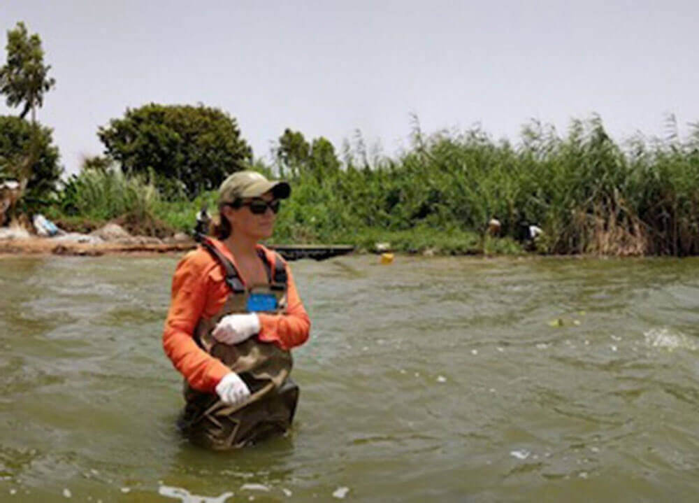 Wolfe wades through a river