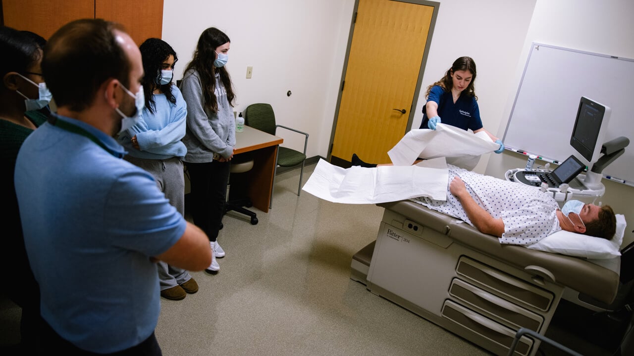 DMS student prepares her patient for the sonograph demonstration.