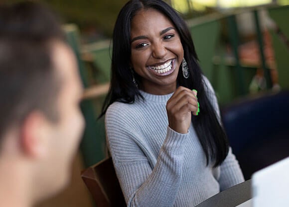 woman laughing in a library