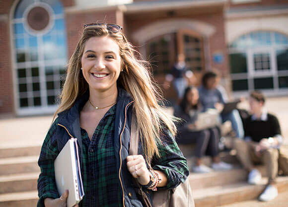 Fisher walks across the quad.