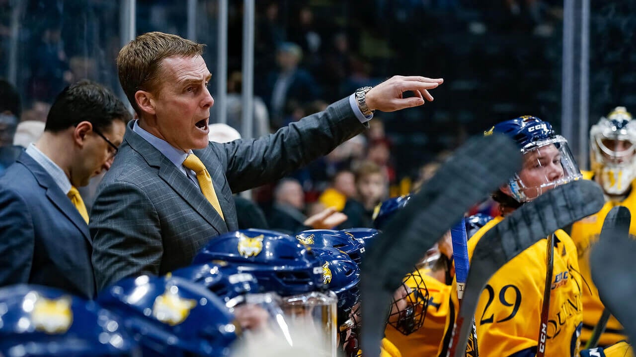 Coach at hockey game