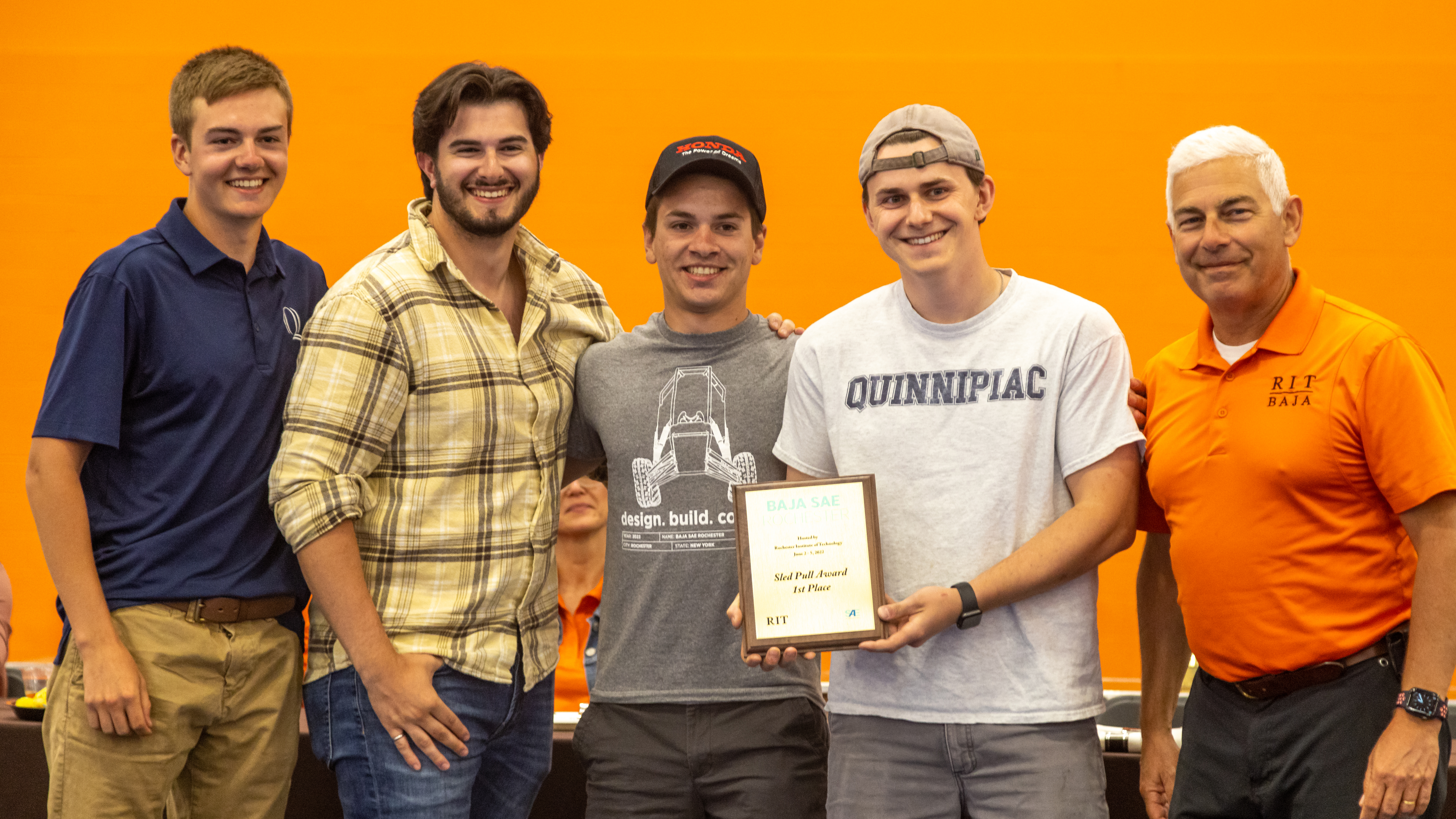 Students pose with award