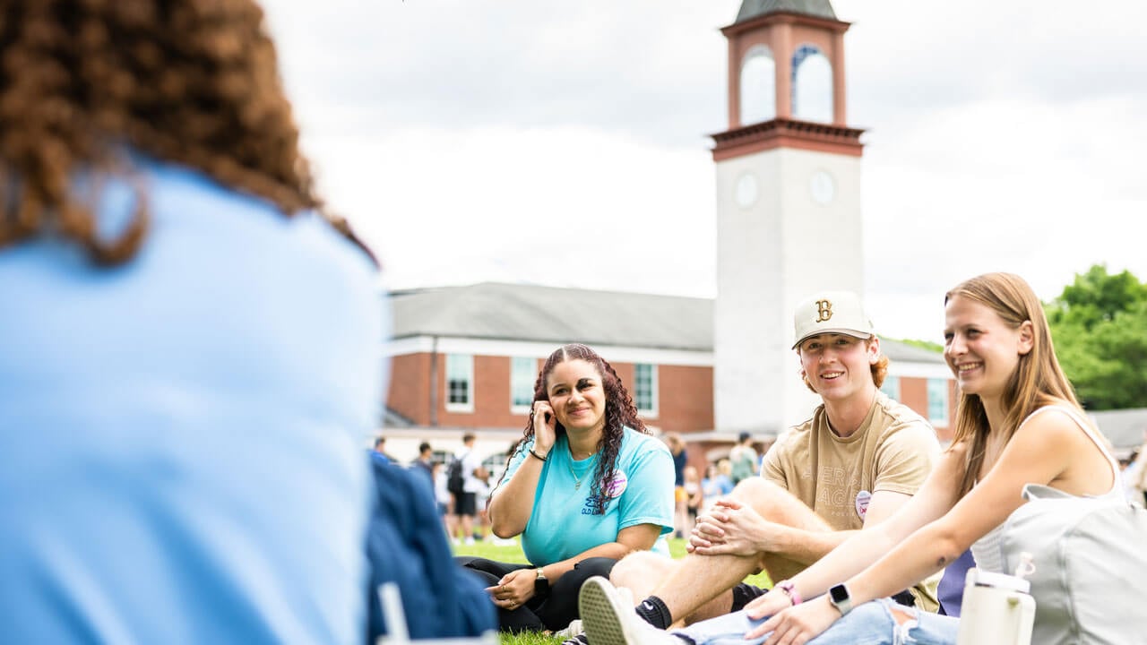 Quinnipiac clock tower in the distance behind Orientation group